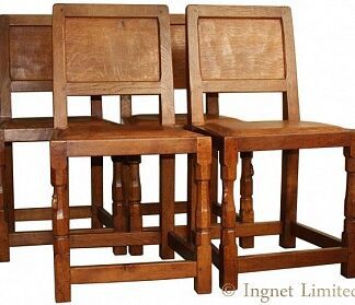 ROBERT MOUSEMAN THOMPSON SET OF FOUR CLASSIC ADZED OAK PANELLED BACK DINING CHAIRS