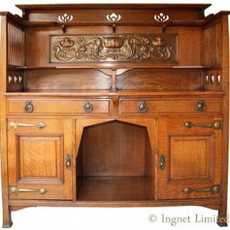 SHAPLAND & PETTER OF BARNSTAPLE OAK SIDEBOARD WITH EMBOSSED COPPER PANEL.